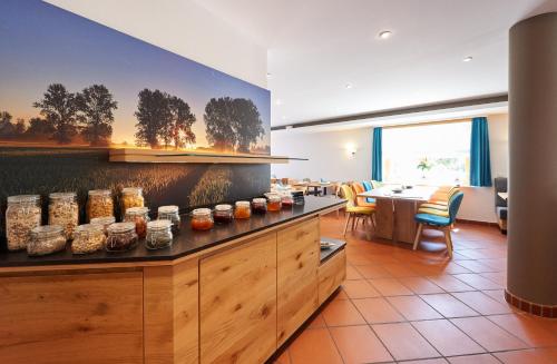a kitchen with jars of food on a counter at Fetzers Landhotel in Ingelheim am Rhein