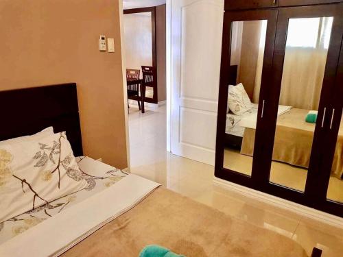 Ένα ή περισσότερα κρεβάτια σε δωμάτιο στο Ecowest Condo beside SM Mall