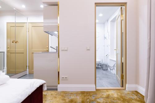 Ένα ή περισσότερα κρεβάτια σε δωμάτιο στο Hotel Meltzer Apartments