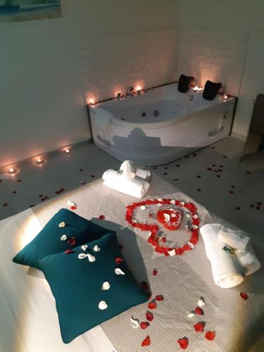 a bathroom with a bath tub with hearts on the floor at Insula b&b in Cagliari