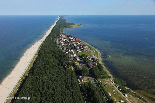 an aerial view of an island in the ocean at Apartament Villa Baltic - Chalupy in Chałupy