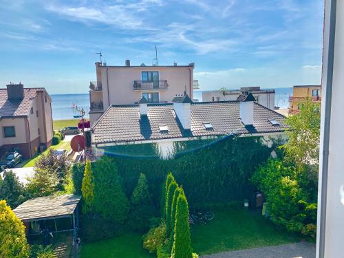 a house with a swimming pool in a yard at Apartament Villa Baltic - Chalupy in Chałupy
