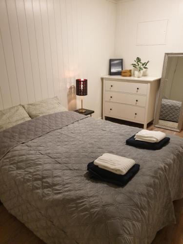 מיטה או מיטות בחדר ב-Strand Apartments