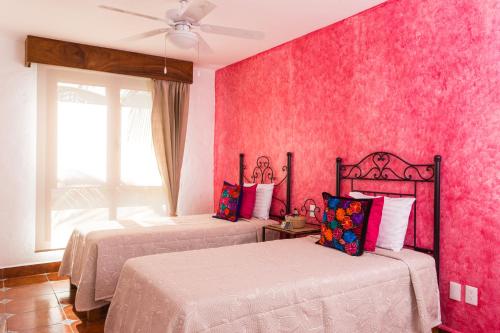 Кровать или кровати в номере Casa Lotería -Pueblito Sayulita- Colorful, Family and Relax Experience with Private Parking and Pool