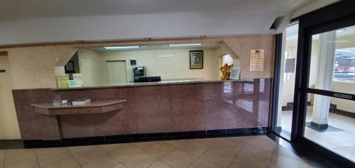 a lobby with a large mirror in a building at FairBridge Inn & Suites in McDonough