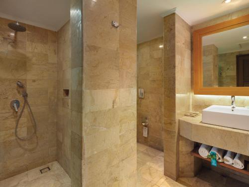 a bathroom with a sink and a shower at SOL by Meli&aacute; Benoa Bali All inclusive in Nusa Dua