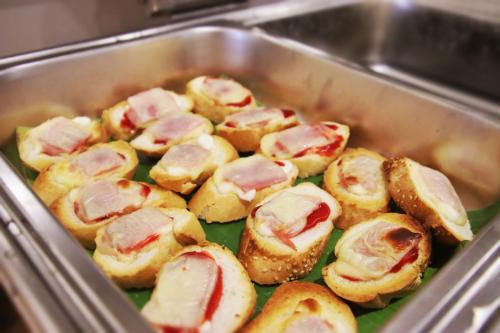 a metal pan filled with mini pigs in a blanket at Grand Elevation Hotel in Phnom Penh