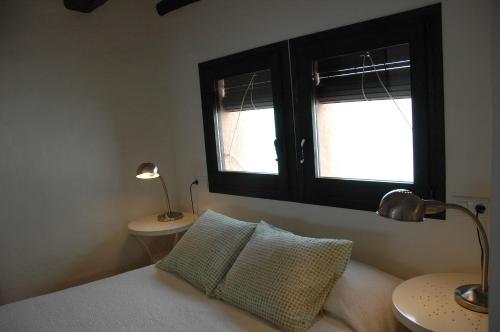 Habitaciones con encanto - Cal Alejandroにあるベッド