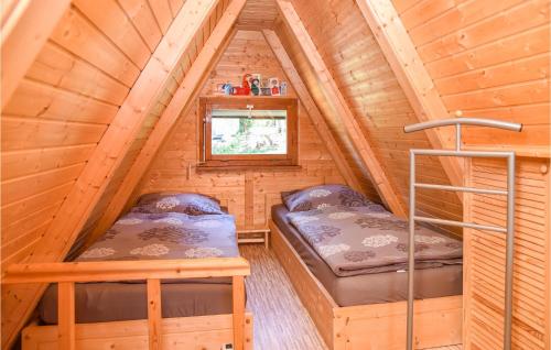 Postelja oz. postelje v sobi nastanitve Lovely Home In Goldlauter-heidersbach With Sauna