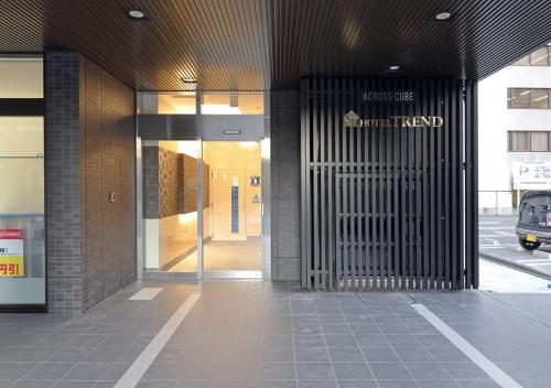 an entrance to a building with a revolving door at Hotel Trend Okayama Ekimae in Okayama
