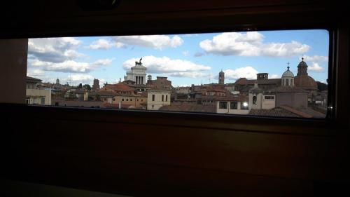 a view of a city from a window at BB Il Re Alla Reginella Guest House in Rome