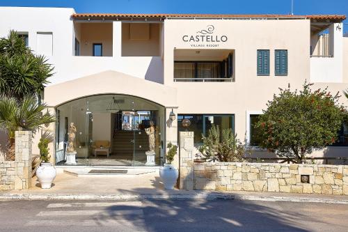 a white building with a sign that reads castilla antigua at Castello Village Resort in Sisi