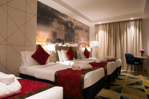 Säng eller sängar i ett rum på Hibatullah Hotel Makkah