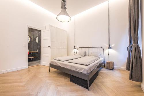 a bedroom with a bed in a room at IRANYI Home - flat in the heart of downtown in Budapest