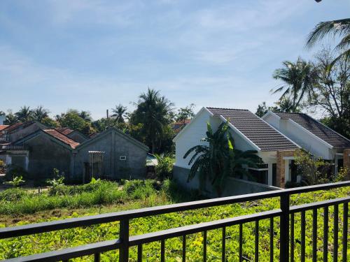 a view of some houses from a balcony at Hoàng Ngọc's House in Tuy Hoa