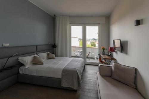 Posteľ alebo postele v izbe v ubytovaní B&B The Attico