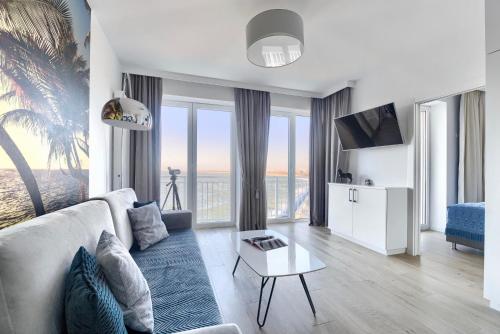 Μια τηλεόραση ή/και κέντρο ψυχαγωγίας στο Apartamenty Marina z widokiem na morze