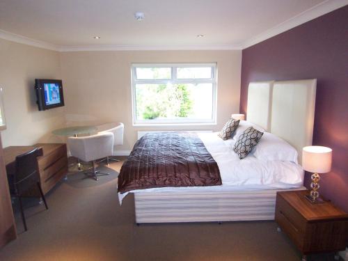 Ένα ή περισσότερα κρεβάτια σε δωμάτιο στο Bagshaw Lodge