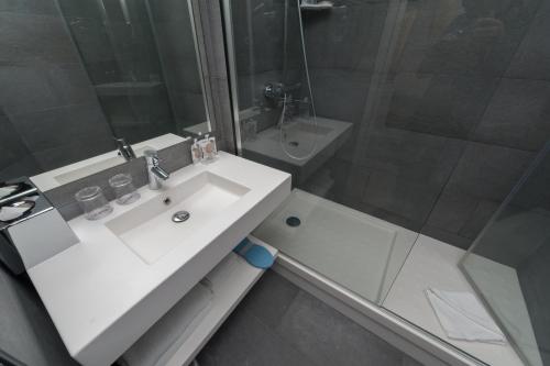 a bathroom with a sink and a toilet and a shower at Hôtel le 209 Paris Bercy in Paris