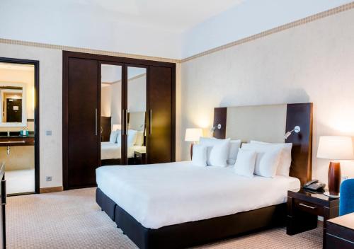 Postel nebo postele na pokoji v ubytování Hotel Polonia Palace