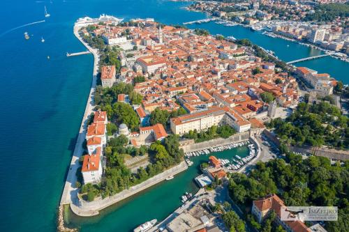 an aerial view of the city of šibenik on the water at Villa Miri in Privlaka