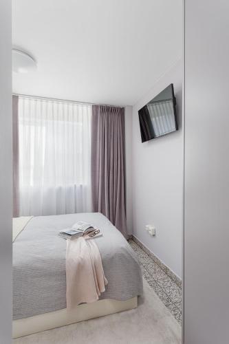 Ein Bett oder Betten in einem Zimmer der Unterkunft VISIONAPARTMENTS Lucerne - contactless check-in