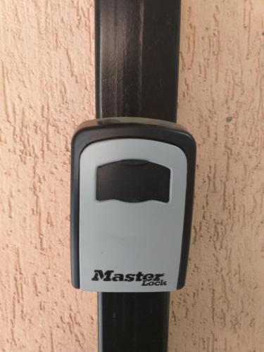 a black and white object with a toaster on a wall at Luxury Daniel Apartament Residence Militari in Roşu
