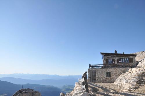 a building on the side of a mountain at Cimon Dolomites Hotel in Predazzo