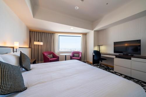 Postel nebo postele na pokoji v ubytování ANA Crowne Plaza Hotel Grand Court Nagoya by IHG