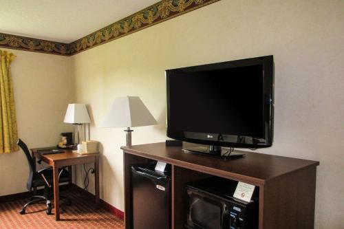 a flat screen tv sitting on top of a dresser at Quality Inn in Sawyer