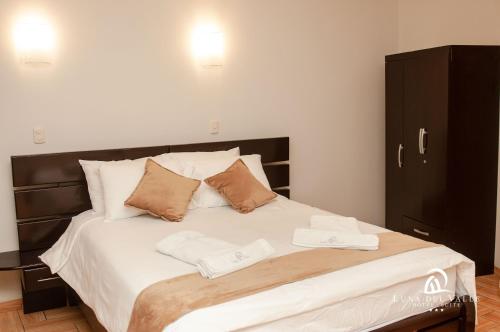 Katil atau katil-katil dalam bilik di Hotel Suite Luna del Valle