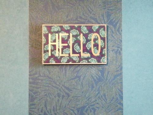 a sign that says hello hanging on a wall at Un nid entre vignes et pierres "Pic St Loup" Claret in Claret