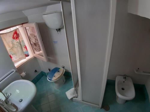 a small bathroom with a sink and a toilet at Casa Vacanza Niki in Gaeta