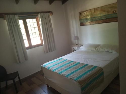 Postel nebo postele na pokoji v ubytování Cabaña la Florecida
