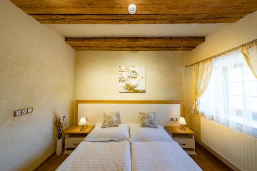 מיטה או מיטות בחדר ב-Residence Terčino Údolí