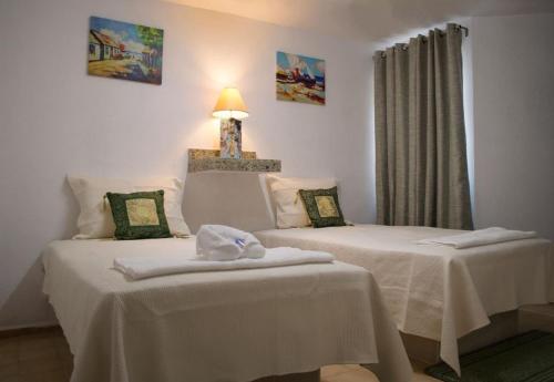 Lova arba lovos apgyvendinimo įstaigoje Hotel Sta Lucía