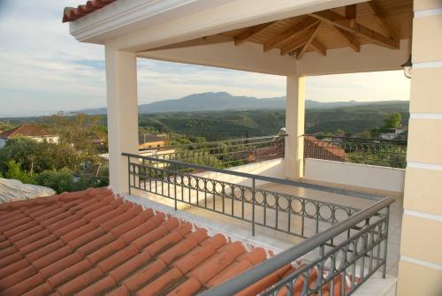 a balcony with a view of the mountains at Luxury villa with a swimming pool in Lefkochoara, Messinias in Levkokhóra