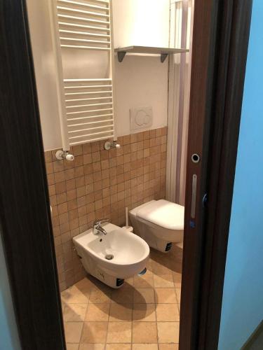 a bathroom with a sink and a toilet at FORT.Montagna A106 in Rivisondoli