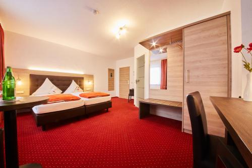 מיטה או מיטות בחדר ב-Hotel Schoos