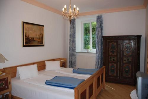 Postel nebo postele na pokoji v ubytování Villa Kreuthhof Appartements