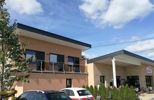 a building with cars parked in front of it at Bierhäusel in Kircheib