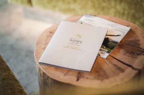 a book sitting on top of a wooden table at Alpine Resort Goies Superior in Ladis