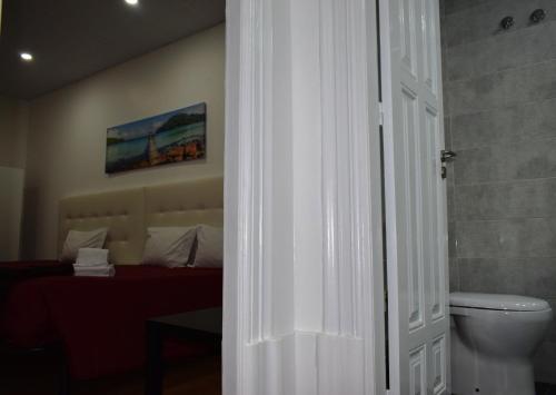 Ліжко або ліжка в номері Guest House Henrique VIII