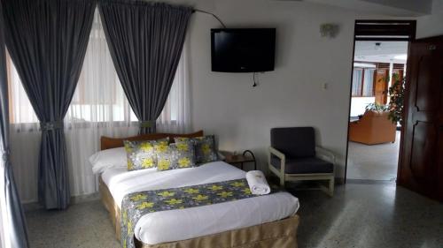 Postel nebo postele na pokoji v ubytování Hotel Mirador Santana