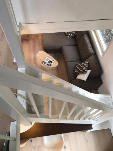 an overhead view of a living room with a staircase at IJSSELMEER Lake houses in Andijk