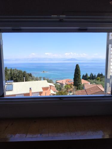 a view of the ocean from a window at Marilena's house in Nótos