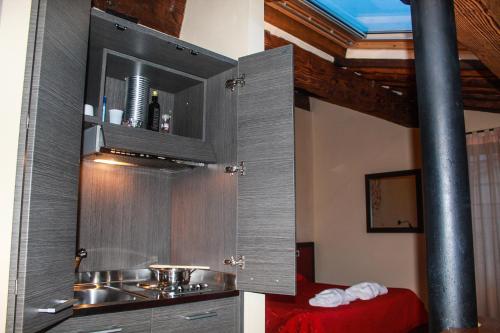 a kitchen with a cupboard in a room at B&B Il Seminario in Lucca