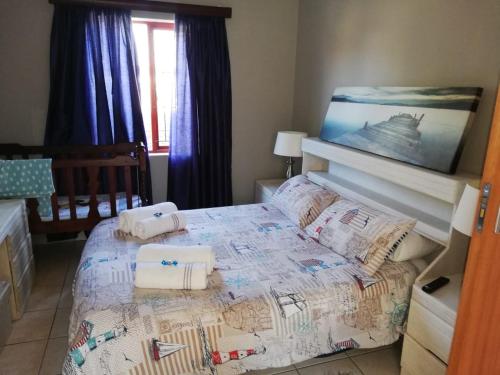 a bedroom with a bed with a map on it at Glentana Silver Moon Self Catering in Glentana