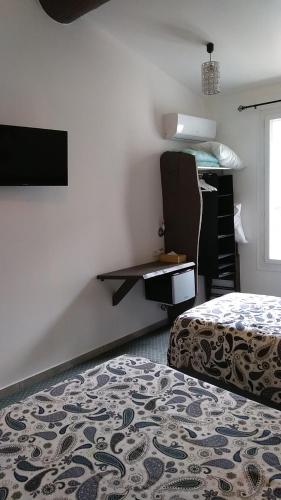 Un ou plusieurs lits dans un hébergement de l'établissement Mauguio Center Hôtel