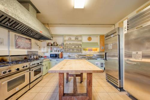 a large kitchen with a wooden table in it at HI Point Reyes Hostel in Point Reyes Station